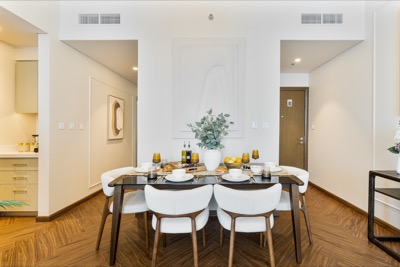 Dining area set for breakfast beside the open kitchen