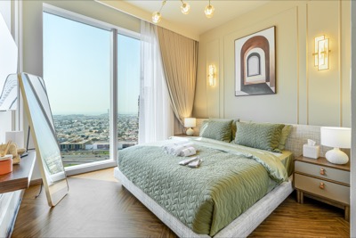 Sage-green principal bedroom with city views