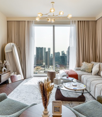 Lounge seating area with curved sofas and skyline beyond